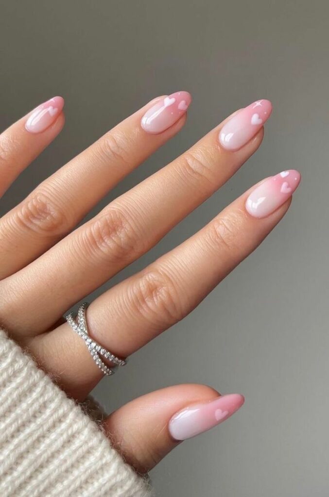 Romantic almond nail design for valentines
Soft pink blushing heart nail art
Dreamy love-inspired almond nail style
Elegant heart nail design for her
Blush-toned romantic nail inspiration