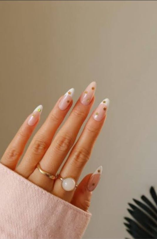 "Elegant almond-shaped nails with chic nude polish, perfect for professional women and fashion-forward brides"
"Trendy almond nail design: soft pastel ombré with subtle glitter, ideal for college girls and young professionals"
"Sophisticated almond nail art: minimal geometric accents in metallic tones, bridging work and party styles"
"Romantic almond nails: soft pink gradient with delicate pearl embellishments, perfect for wedding celebrations"
"Bold almond nail statement: deep burgundy with matte finish, empowering look for confident women"
"Versatile almond nail design: neutral base with intricate white lace-like patterns, suitable for teachers and creatives"
"Glamorous almond nails: holographic shine meets classic French tip, celebrating feminine elegance"
"Winter-inspired almond nails: icy blue with silver snowflake details, chic for holiday parties"
"Vibrant almond nail art: tropical sunset ombré with golden highlights, perfect for Valentine's celebrations"
"Minimalist almond nails: clean nude base with single accent rhinestone, embodying understated sophistication"
