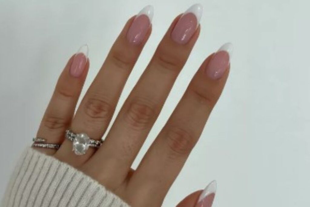"Elegant almond-shaped nails with chic nude polish, perfect for professional women and fashion-forward brides"
"Trendy almond nail design: soft pastel ombré with subtle glitter, ideal for college girls and young professionals"
"Sophisticated almond nail art: minimal geometric accents in metallic tones, bridging work and party styles"
"Romantic almond nails: soft pink gradient with delicate pearl embellishments, perfect for wedding celebrations"
"Bold almond nail statement: deep burgundy with matte finish, empowering look for confident women"
"Versatile almond nail design: neutral base with intricate white lace-like patterns, suitable for teachers and creatives"
"Glamorous almond nails: holographic shine meets classic French tip, celebrating feminine elegance"
"Winter-inspired almond nails: icy blue with silver snowflake details, chic for holiday parties"
"Vibrant almond nail art: tropical sunset ombré with golden highlights, perfect for Valentine's celebrations"
"Minimalist almond nails: clean nude base with single accent rhinestone, embodying understated sophistication"
