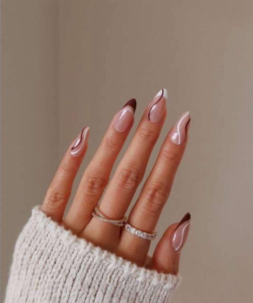 "Elegant almond-shaped nails with chic nude polish, perfect for professional women and fashion-forward brides"
"Trendy almond nail design: soft pastel ombré with subtle glitter, ideal for college girls and young professionals"
"Sophisticated almond nail art: minimal geometric accents in metallic tones, bridging work and party styles"
"Romantic almond nails: soft pink gradient with delicate pearl embellishments, perfect for wedding celebrations"
"Bold almond nail statement: deep burgundy with matte finish, empowering look for confident women"
"Versatile almond nail design: neutral base with intricate white lace-like patterns, suitable for teachers and creatives"
"Glamorous almond nails: holographic shine meets classic French tip, celebrating feminine elegance"
"Winter-inspired almond nails: icy blue with silver snowflake details, chic for holiday parties"
"Vibrant almond nail art: tropical sunset ombré with golden highlights, perfect for Valentine's celebrations"
"Minimalist almond nails: clean nude base with single accent rhinestone, embodying understated sophistication"
