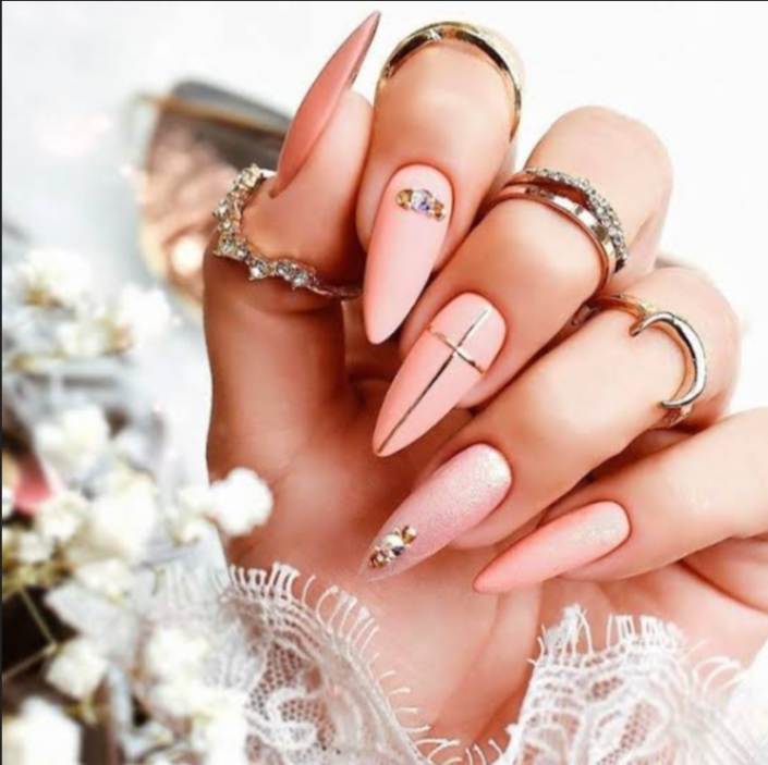 "Elegant almond-shaped nails with chic nude polish, perfect for professional women and fashion-forward brides"
"Trendy almond nail design: soft pastel ombré with subtle glitter, ideal for college girls and young professionals"
"Sophisticated almond nail art: minimal geometric accents in metallic tones, bridging work and party styles"
"Romantic almond nails: soft pink gradient with delicate pearl embellishments, perfect for wedding celebrations"
"Bold almond nail statement: deep burgundy with matte finish, empowering look for confident women"
"Versatile almond nail design: neutral base with intricate white lace-like patterns, suitable for teachers and creatives"
"Glamorous almond nails: holographic shine meets classic French tip, celebrating feminine elegance"
"Winter-inspired almond nails: icy blue with silver snowflake details, chic for holiday parties"
"Vibrant almond nail art: tropical sunset ombré with golden highlights, perfect for Valentine's celebrations"
"Minimalist almond nails: clean nude base with single accent rhinestone, embodying understated sophistication"
