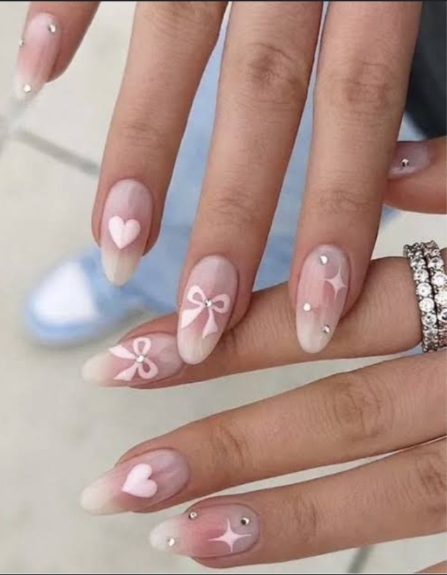 "Elegant almond-shaped nails with chic nude polish, perfect for professional women and fashion-forward brides"
"Trendy almond nail design: soft pastel ombré with subtle glitter, ideal for college girls and young professionals"
"Sophisticated almond nail art: minimal geometric accents in metallic tones, bridging work and party styles"
"Romantic almond nails: soft pink gradient with delicate pearl embellishments, perfect for wedding celebrations"
"Bold almond nail statement: deep burgundy with matte finish, empowering look for confident women"
"Versatile almond nail design: neutral base with intricate white lace-like patterns, suitable for teachers and creatives"
"Glamorous almond nails: holographic shine meets classic French tip, celebrating feminine elegance"
"Winter-inspired almond nails: icy blue with silver snowflake details, chic for holiday parties"
"Vibrant almond nail art: tropical sunset ombré with golden highlights, perfect for Valentine's celebrations"
"Minimalist almond nails: clean nude base with single accent rhinestone, embodying understated sophistication"
