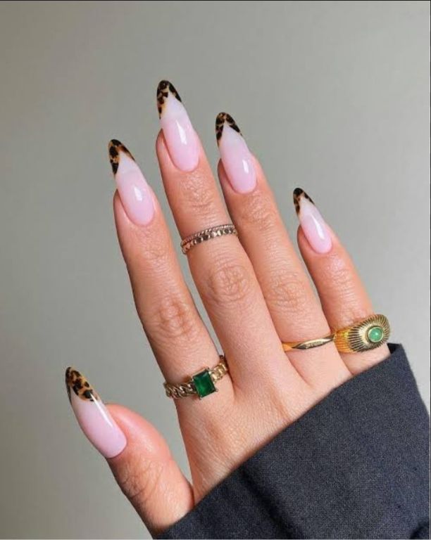 "Elegant almond-shaped nails with chic nude polish, perfect for professional women and fashion-forward brides"
"Trendy almond nail design: soft pastel ombré with subtle glitter, ideal for college girls and young professionals"
"Sophisticated almond nail art: minimal geometric accents in metallic tones, bridging work and party styles"
"Romantic almond nails: soft pink gradient with delicate pearl embellishments, perfect for wedding celebrations"
"Bold almond nail statement: deep burgundy with matte finish, empowering look for confident women"
"Versatile almond nail design: neutral base with intricate white lace-like patterns, suitable for teachers and creatives"
"Glamorous almond nails: holographic shine meets classic French tip, celebrating feminine elegance"
"Winter-inspired almond nails: icy blue with silver snowflake details, chic for holiday parties"
"Vibrant almond nail art: tropical sunset ombré with golden highlights, perfect for Valentine's celebrations"
"Minimalist almond nails: clean nude base with single accent rhinestone, embodying understated sophistication"
