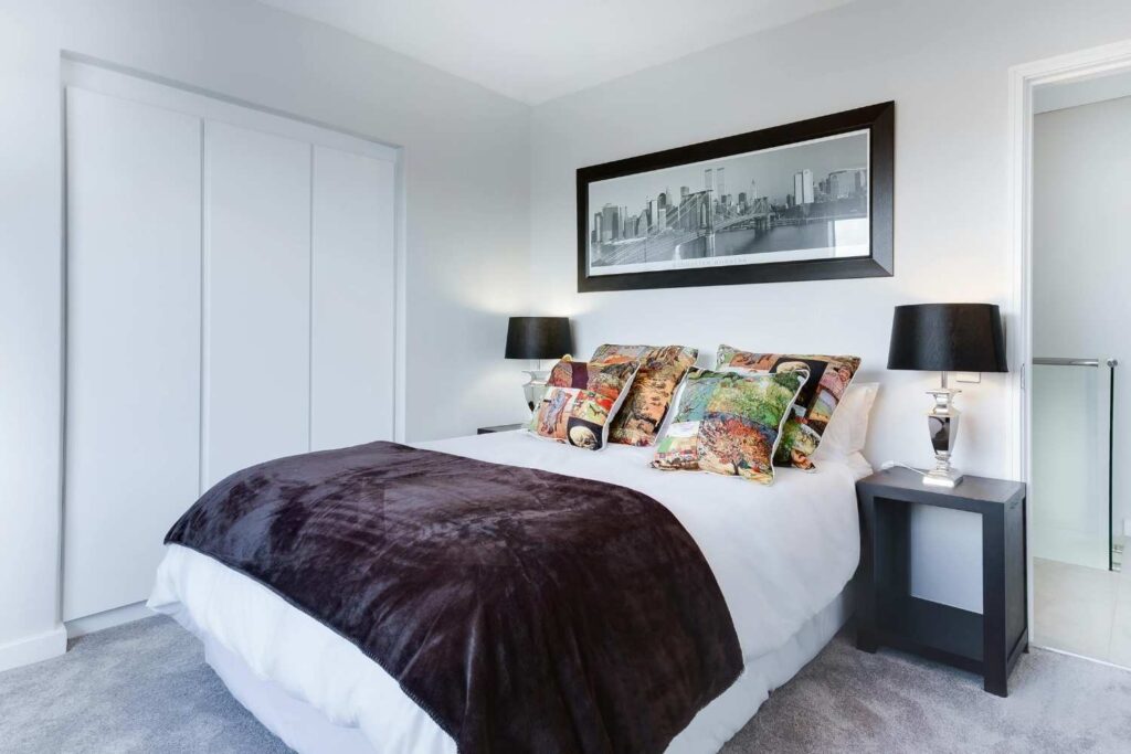 Stylish black and white dream bedroom with elegant decor, cozy bedding, and chic minimalist furniture. Perfect for beauty lovers, brides, and modern women seeking luxury & simplicity.